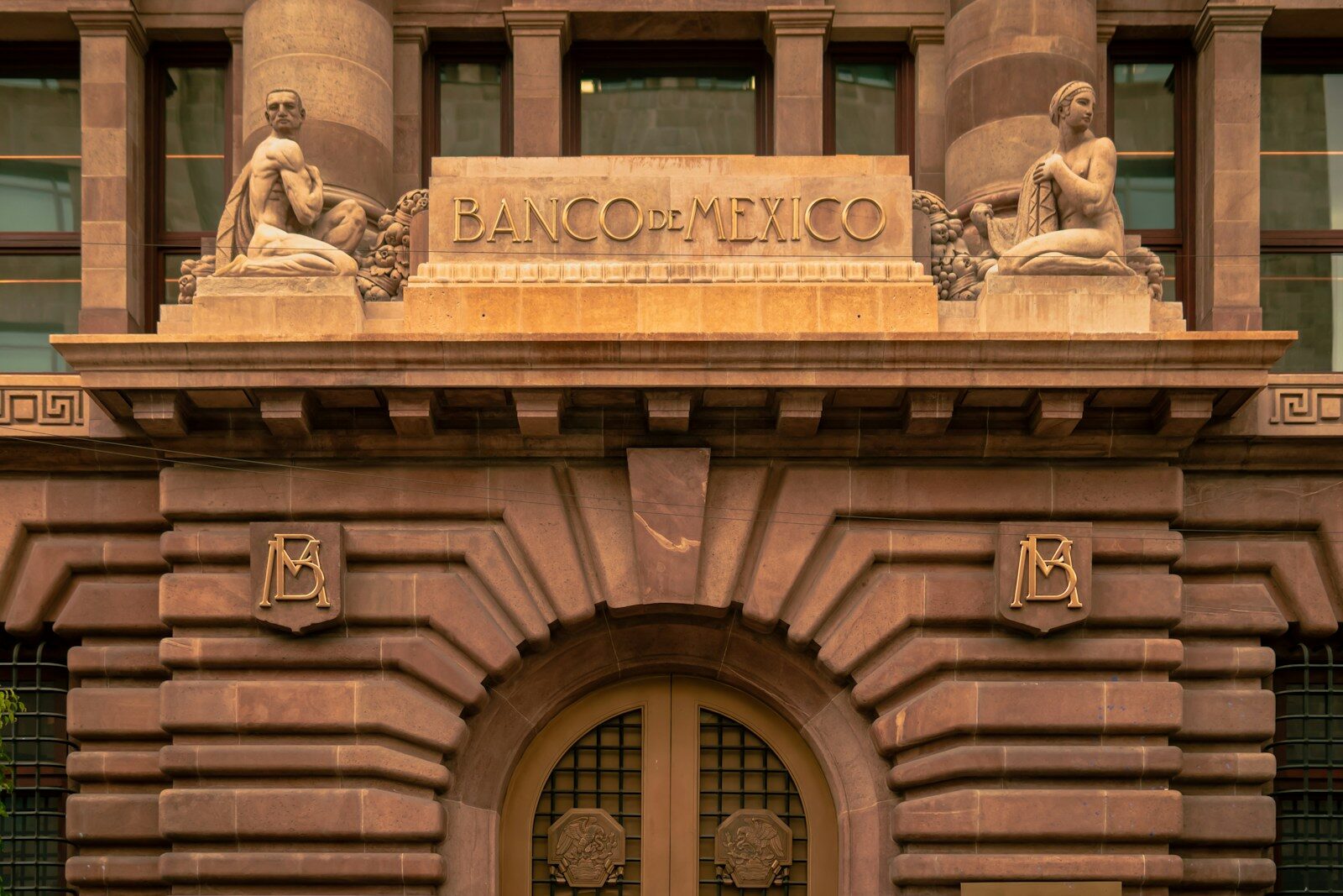 A large building with statues on top of it